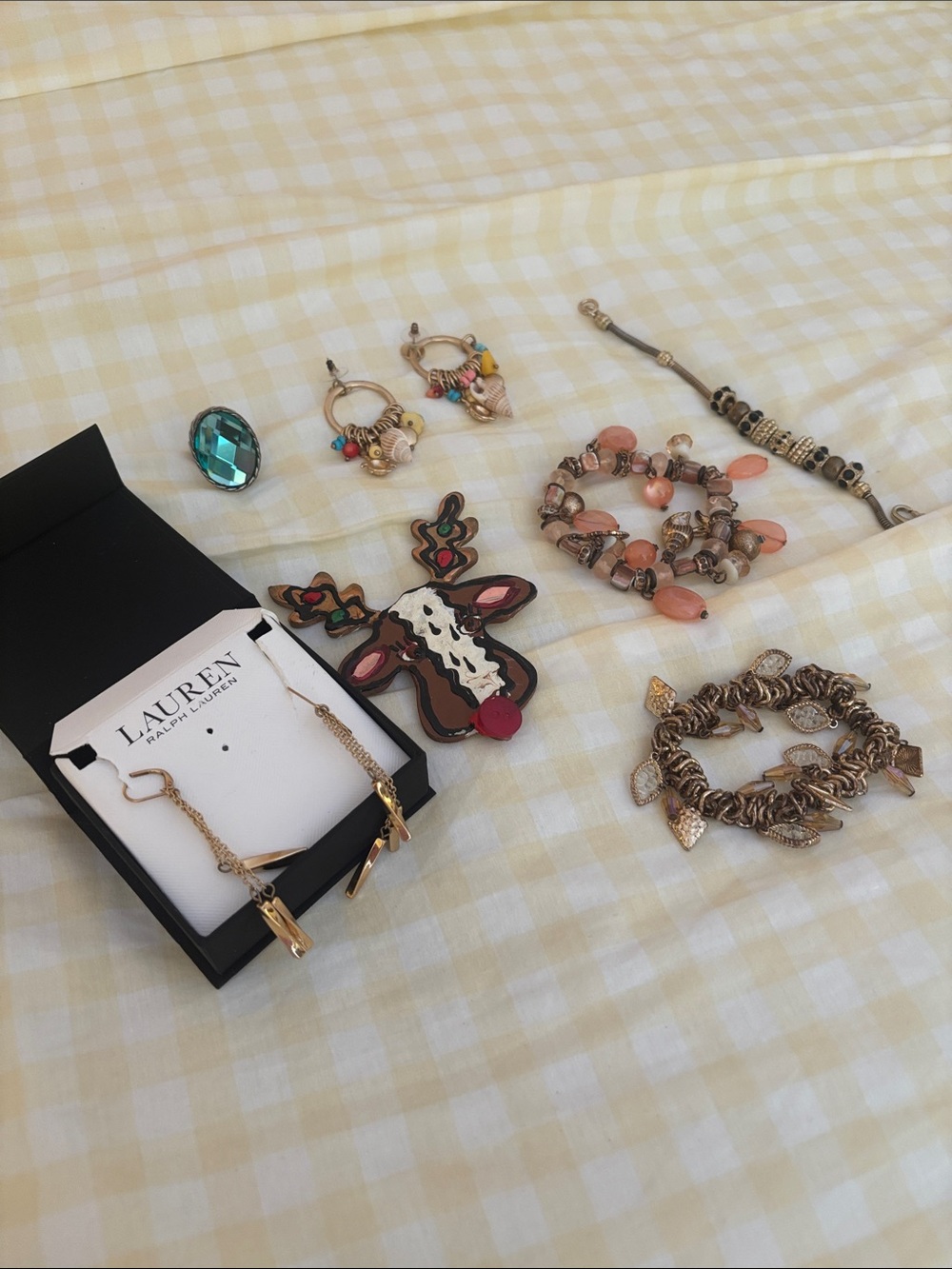 Assortment of different jewelry earrings in box at Ralph Loren